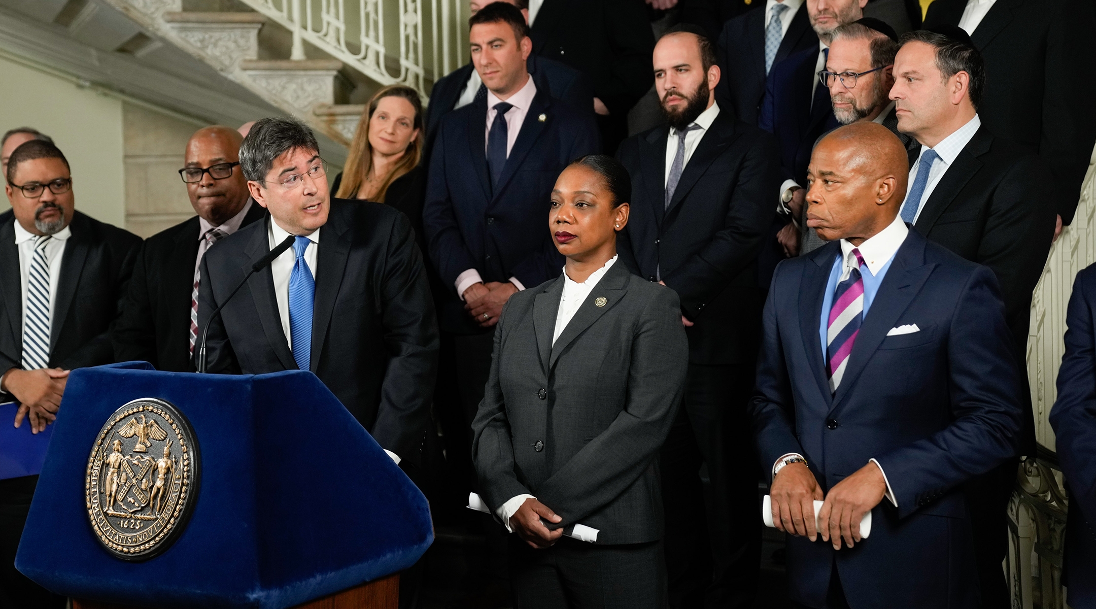 Eric Goldstein, CEO of UJA-Federation of New York; Keechant Sewell, New York City Police Commissioner, and Mayor Eric Adams at a news conference at City Hall discussing the arrest of two suspects plotting attacks on synagogues, Nov. 21, 2022.