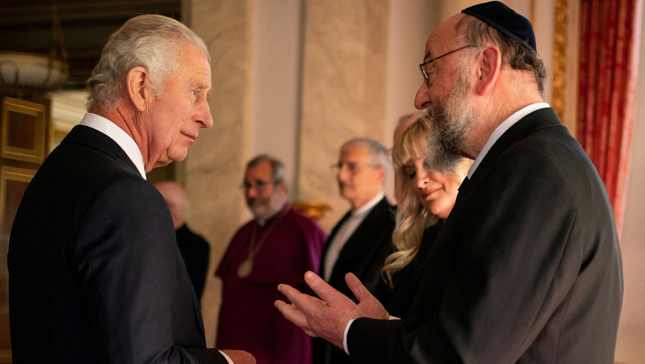King Charles III meets Chief Rabbi Ephraim Mirvis during a reception with faith leaders at Buckingham Palace in London, Sept. 16, 2022. (Aaron Chown/Pool/AFP via Getty Images)