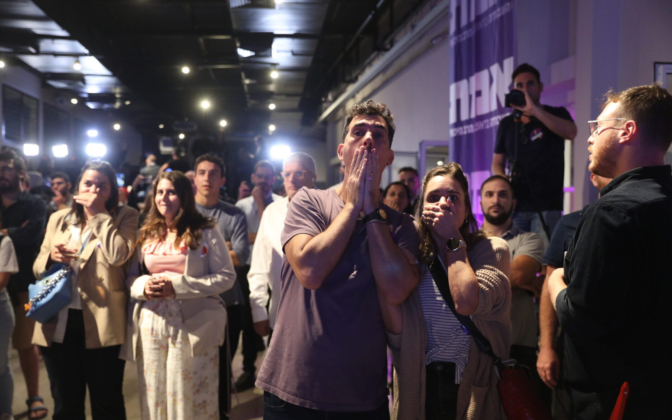 Supporters of the liberal Labor Party react as the results of the Israeli elections are announced, in Tel Aviv, Nov. 1, 2022. (Noam Revkin Fenton/Flash90)