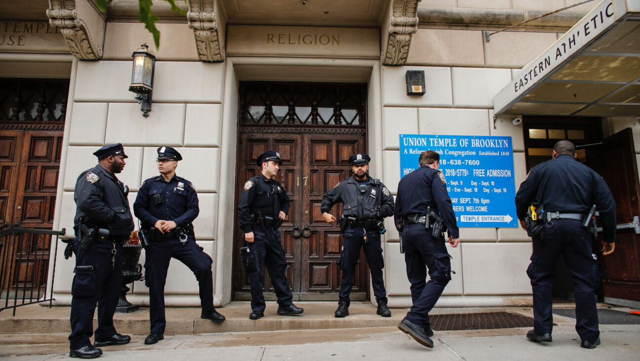 NYPD officers stand guard at the door of the Union Temple of Brooklyn on November 2, 2018.