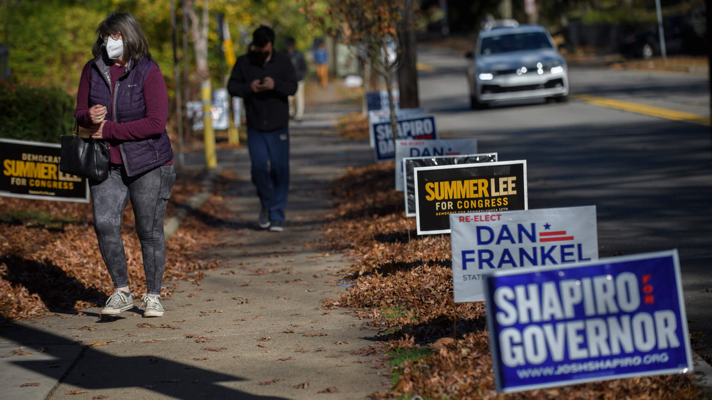 Voters walk to the polls to cast their ballots at the Rodef Shalom Synagogue Tuesday in Pittsburgh.