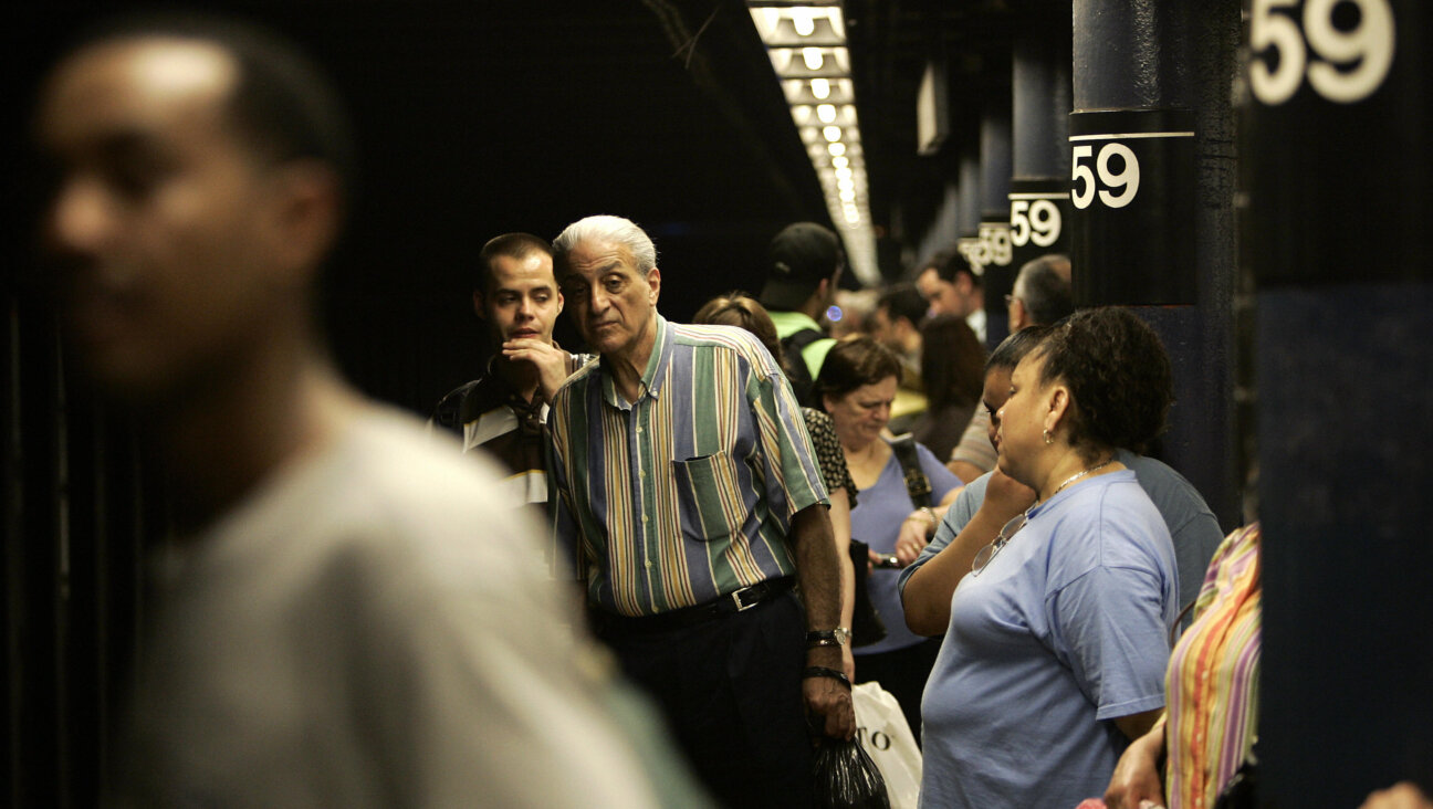 New York City commuters on a subway platform.