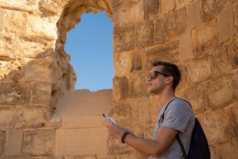 A tourist looks at Masada.