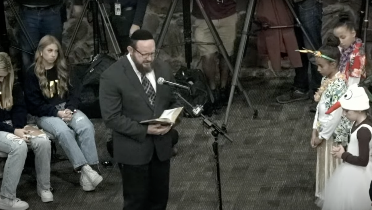 Mark Aaron Griffin, a Messianic “rabbi” awaiting trial on four counts of sexual assault, leads the opening prayer at Keller Independent School District’s board meeting, Dec. 12, 2022. (Screenshot)