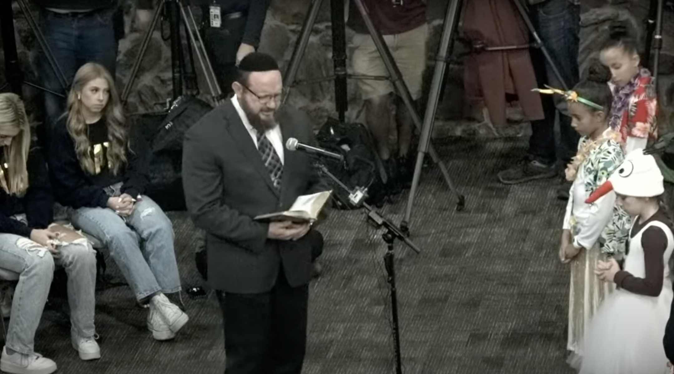 Mark Aaron Griffin, a Messianic “rabbi” awaiting trial on four counts of sexual assault, leads the opening prayer at Keller Independent School District’s board meeting, Dec. 12, 2022. (Screenshot)