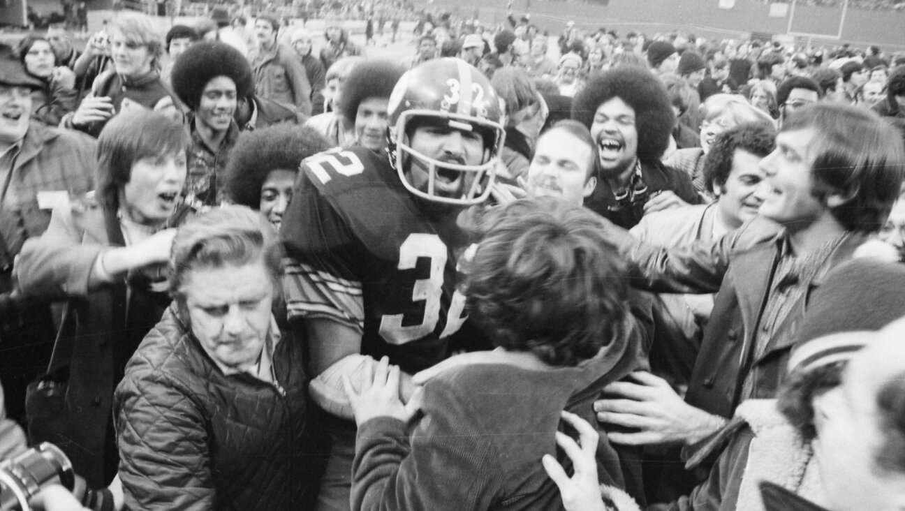 Pittsburgh Steelers’ running back Franco Harris is mobbed by fans at Three Rivers Stadium after scoring the winning touchdown, nicknamed the “Immaculate Reception.” (Getty/Bettmann)