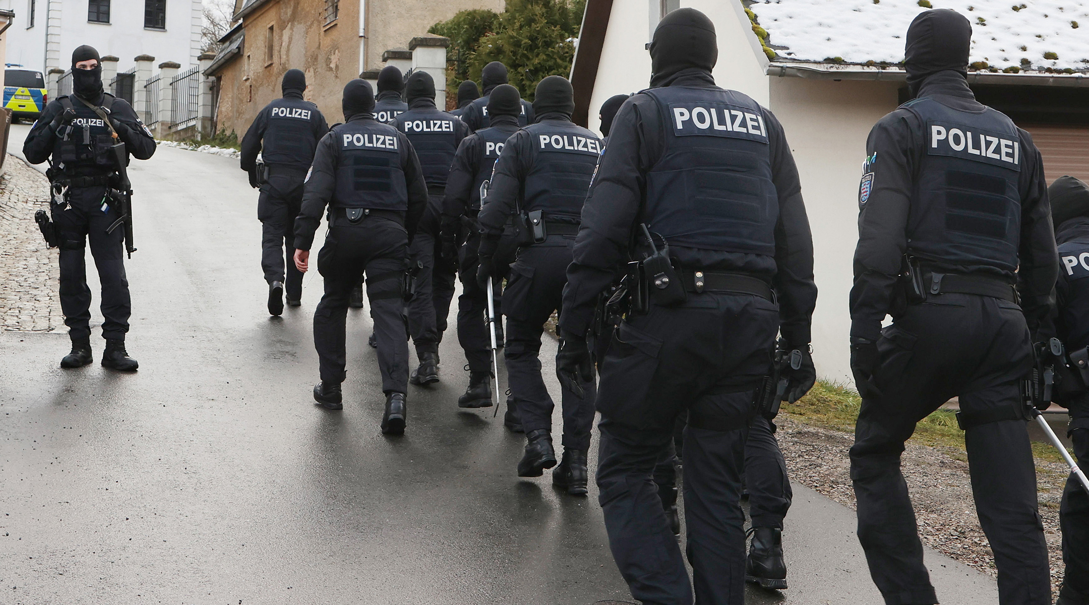 Police perform a raid on suspected members of the Reichsbürger far-right group in Saaldorf, Germany, Dec. 7, 2022. (Bodo Schackow/picture alliance via Getty Images)