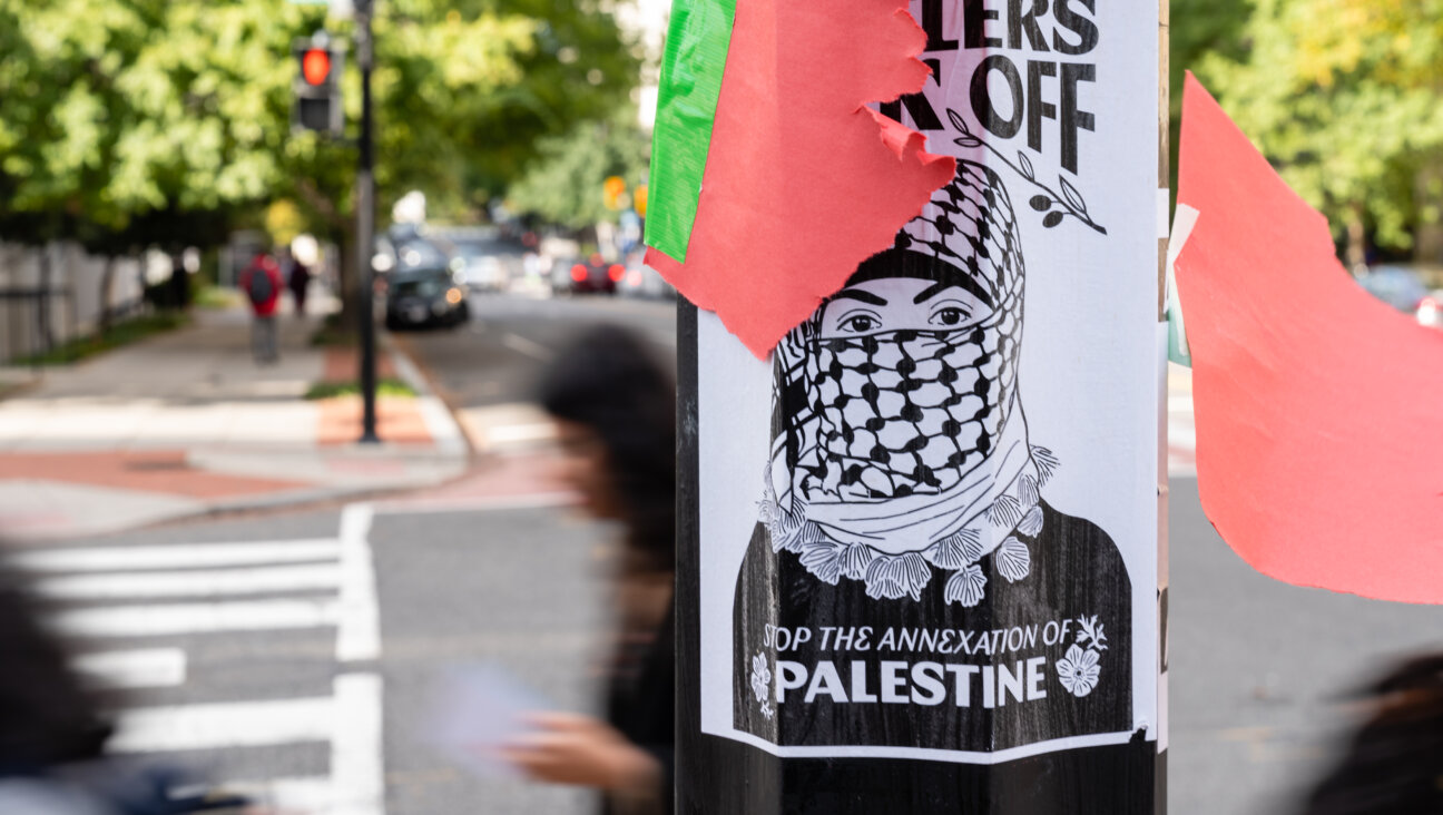 A George Washington University student club and its leader were cleared of wrongdoing Friday for an October incident in which anti-Zionist posters were placed on concrete benches outside the Hillel building. Others were placed on lampposts, including the one pictured above.