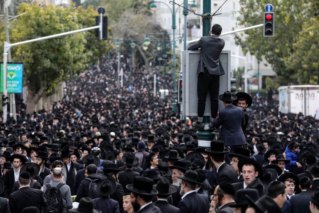Thousands of Haredim throng the streets of Bnei Brak for the funeral of Rabbi Chaim Kanievsky in March, 2022.