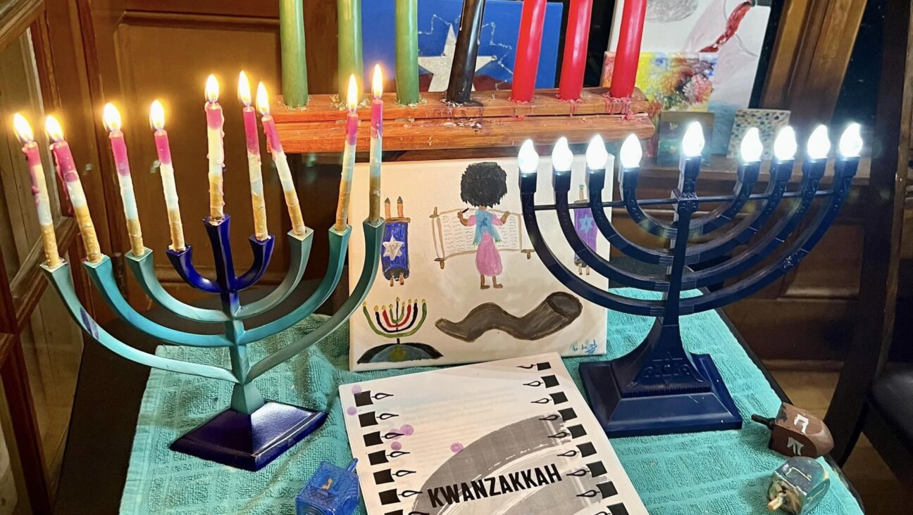 Menorahs, a kinara and a Kwanzakkah guide adorn the Atlanta home of Tarece Johnson-Morgan. Atlanta is one of several cities across the country where  Kwanzakkah celebrations will be held on Monday.