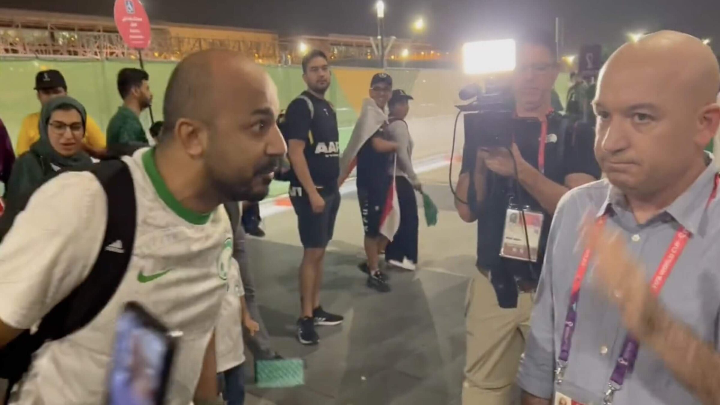 A soccer fan harasses Israeli journalist Moav Vardy at the 2022 World Cup in Qatar. 