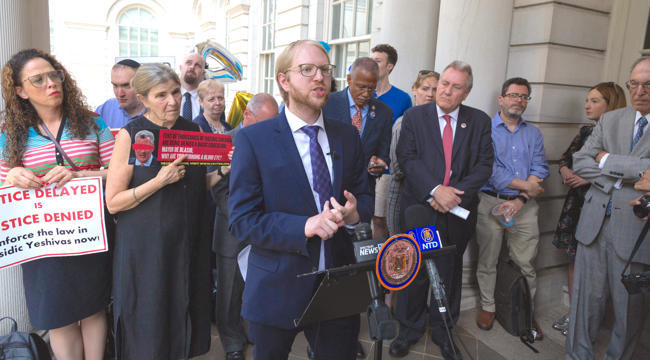 Naftuli Moster, executive director of the nonprofit advocacy group Yaffed, speaks at a news conference, July 24, 2019. (Yaffed)