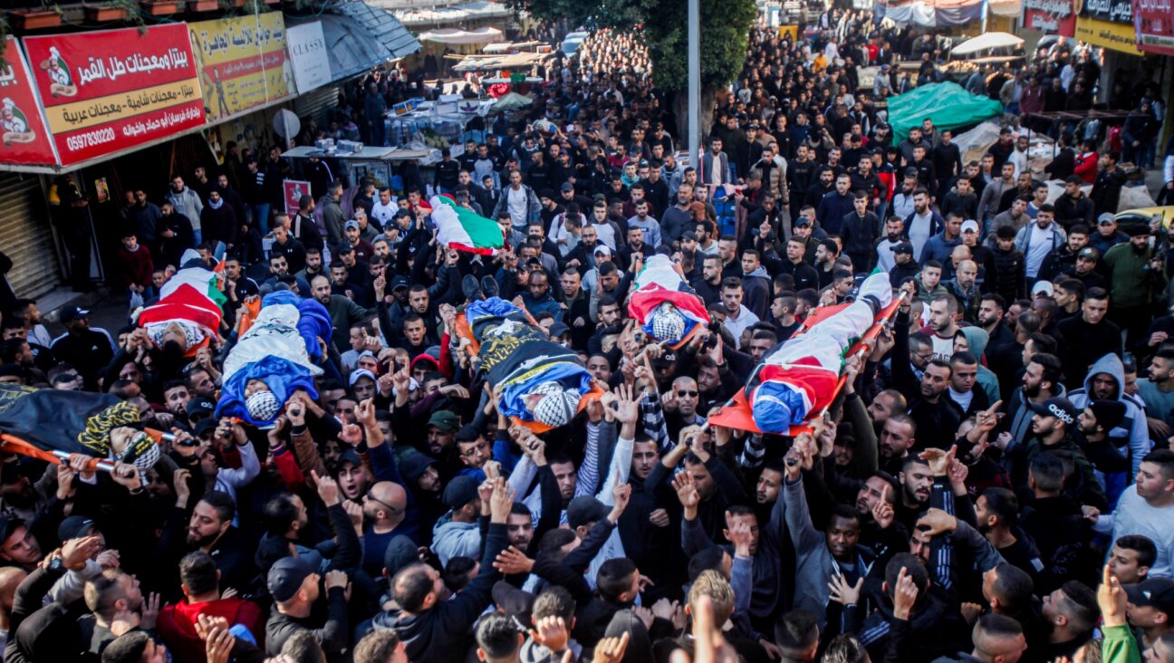 Mourners carry the bodies of Palestinians who were shot dead by Israeli security forces during a Military operation, in the West Bank city of Jenin, Jan. 26, 2023. (Nasser Ishtayeh/Flash90)