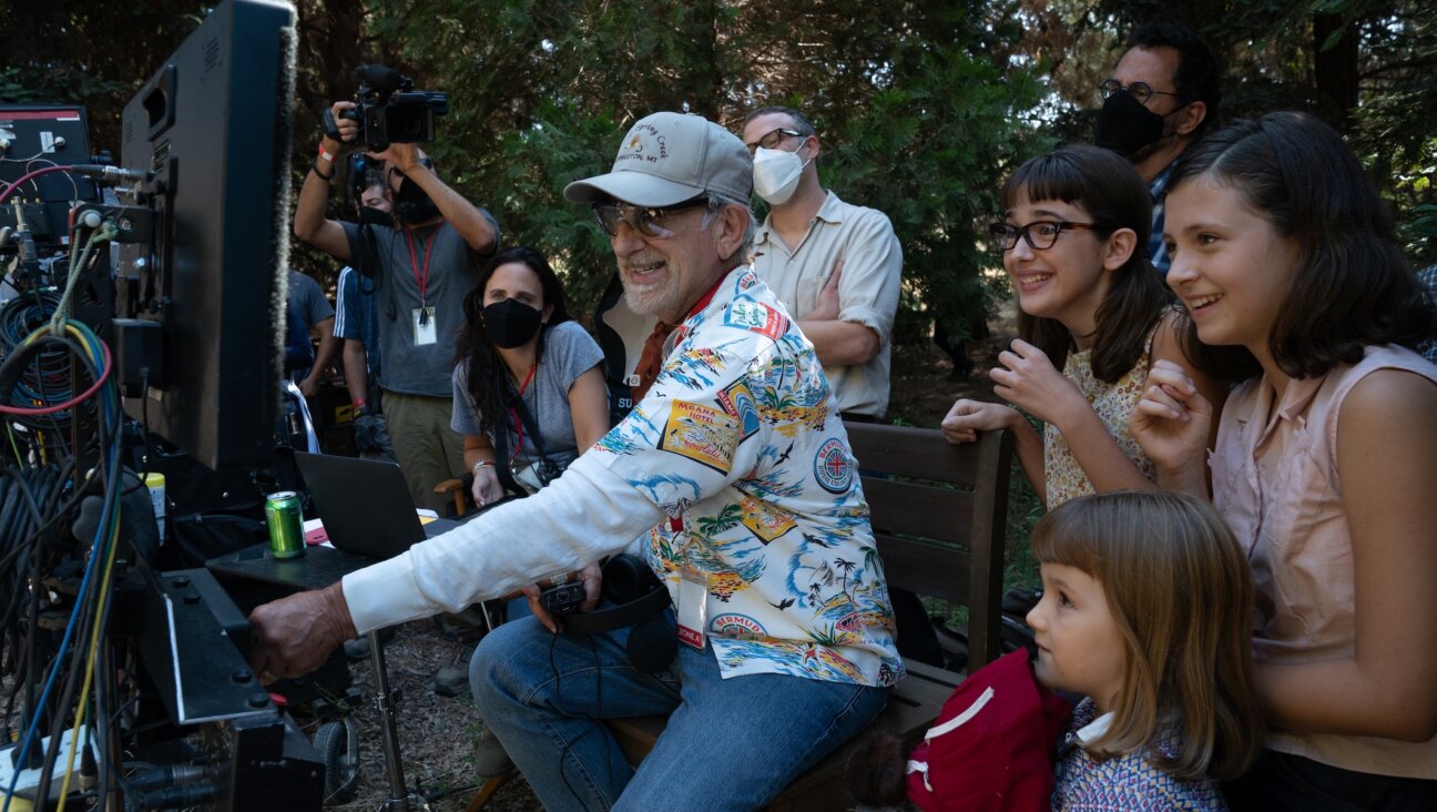 (from left) Producer Kristie Macosko Krieger, co-writer/producer/director Steven Spielberg, Seth Rogen, Julia Butters, co-writer/producer Tony Kushner, Keeley Karsten and Sophia Kopera on the set of “The Fabelmans.” (Merie Weismiller Wallace/Universal Pictures and Amblin Entertainment)