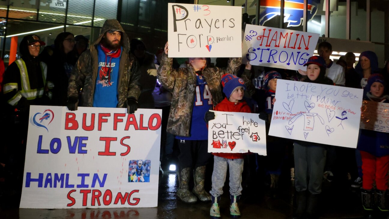 Buffalo Bills fans attend a candlelight prayer vigil for player Damar Hamlin at Highmark Stadium in Orchard Park, N.Y., Jan. 3, 2023. (Timothy T Ludwig/Getty Images)