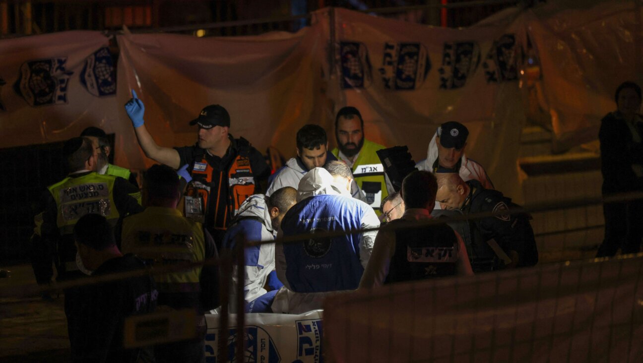 Israeli personnel work at the site of a reported attack in East Jerusalem.