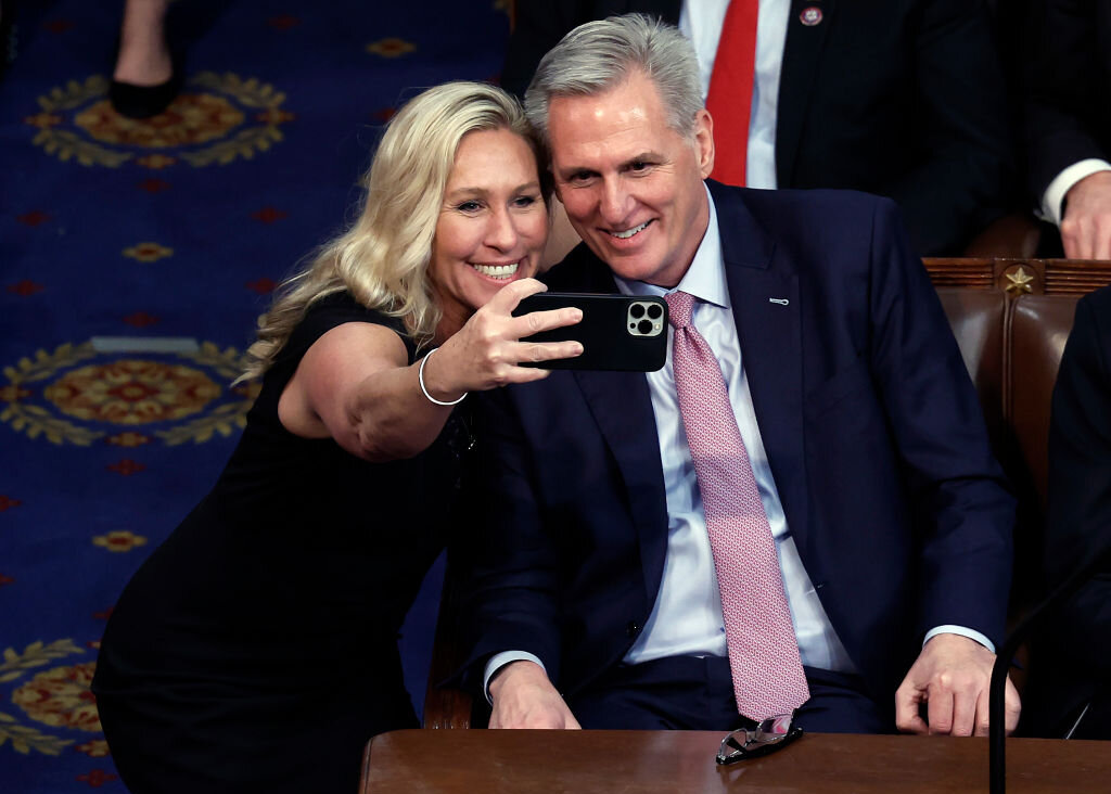 Rep. Marjorie Taylor Greene takes a photo with House Speaker Kevin McCarthy on Jan. 7, 2023.