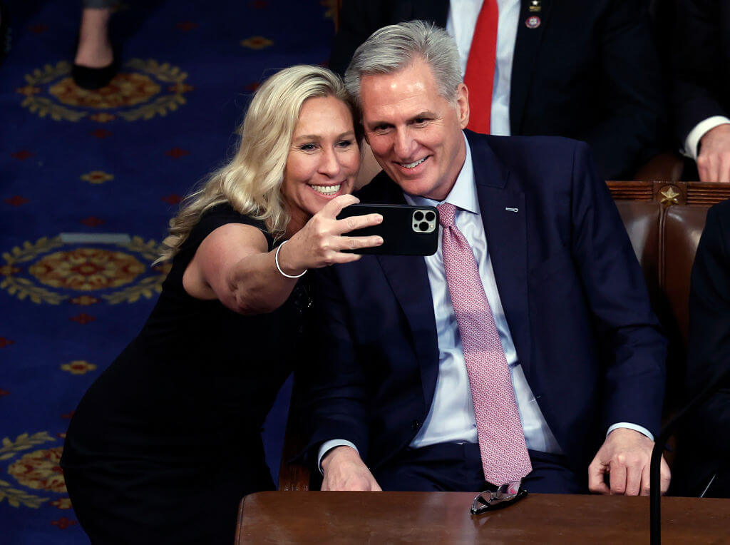 Rep. Marjorie Taylor Greene takes a photo with House Speaker Kevin McCarthy on Jan. 7, 2023.