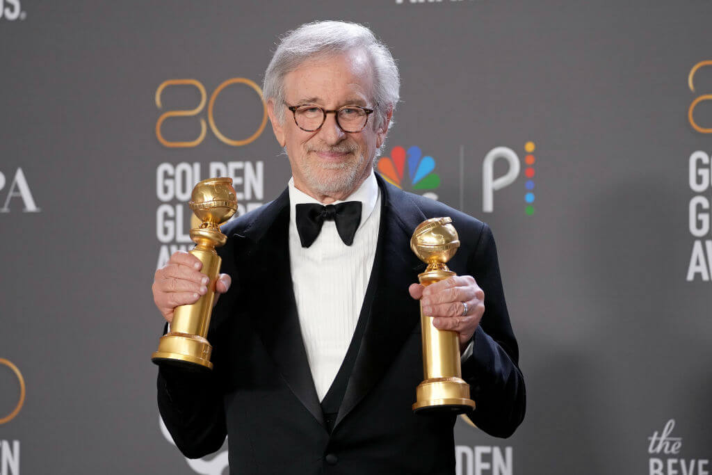 Steven Spielberg poses with awards for best drama and best director for <i>The Fabelmans</i> in the press room during the 80th Annual Golden Globe Awards, Jan. 10, 2023.