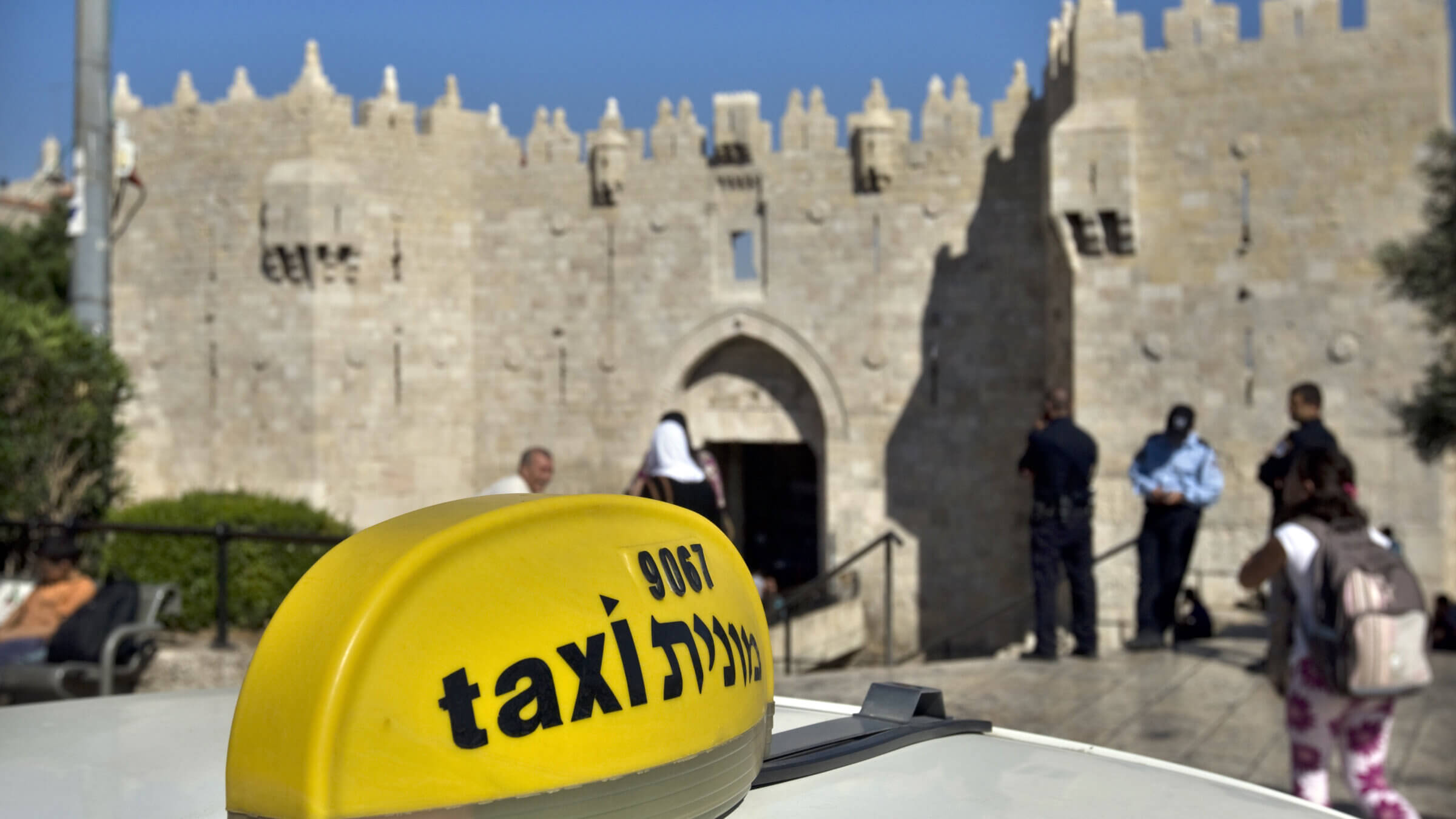 A taxi waits outside Damascus Gate in Jerusalem.