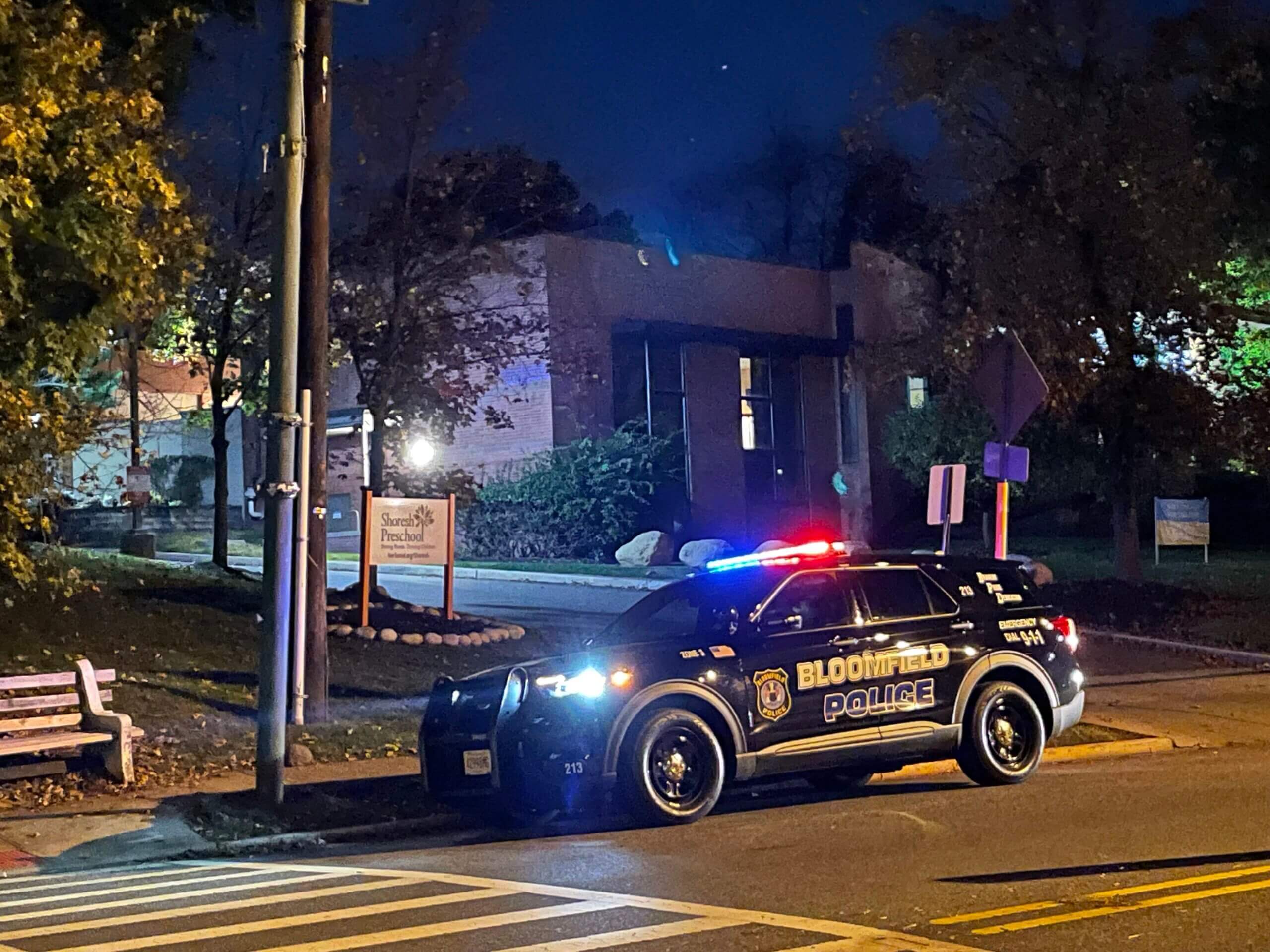 A police car stationed outside of Temple Ner Tamid’s preschool in Bloomfield, New Jersey, after a threat to local area synagogues in November, 2022.