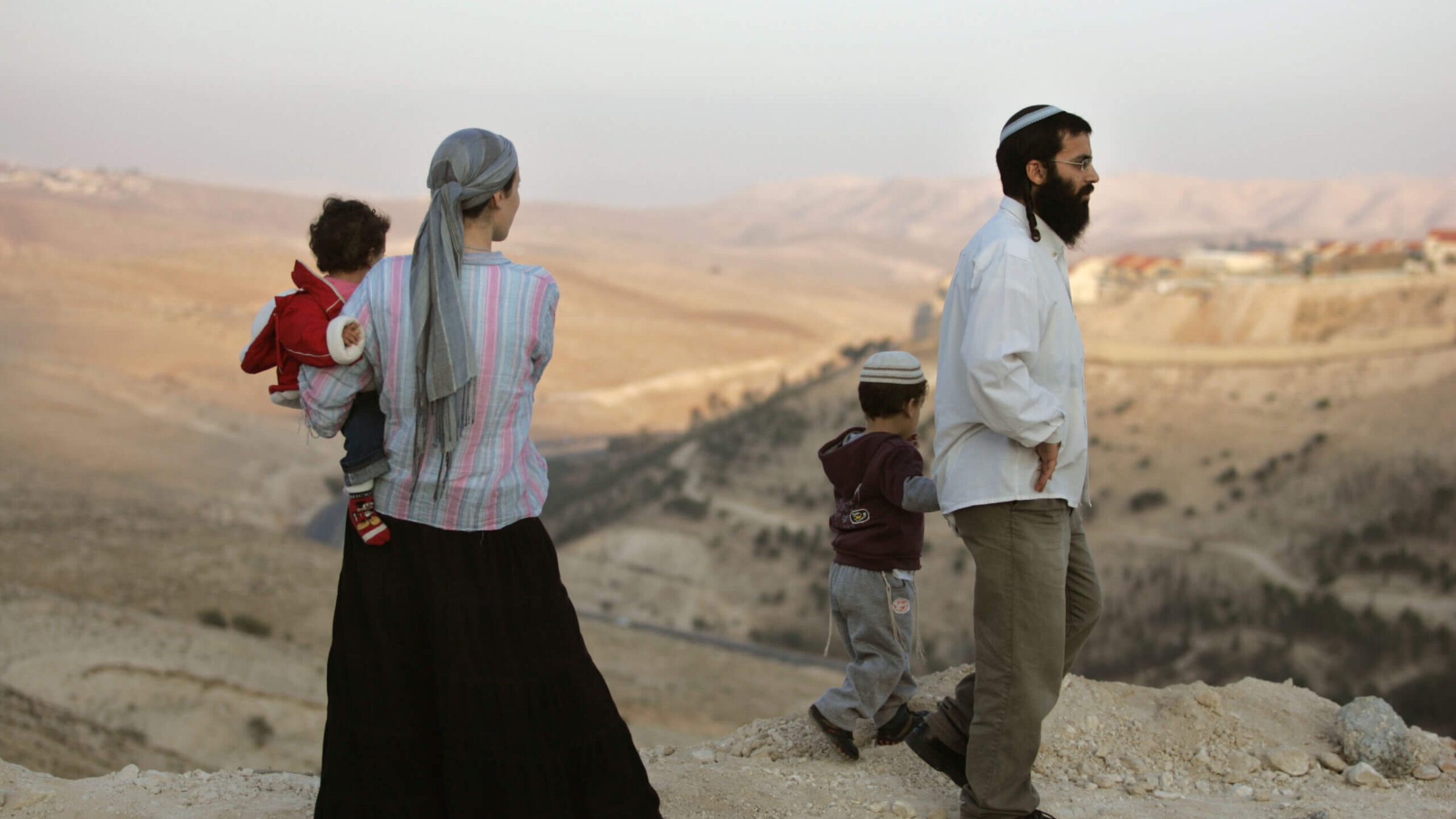 Israeli settlers look at the view as they arrive to the hills at the new E1 settlement area on December 9, 2007 near the Israeli settlement of Maale Adumim in the West Bank. 