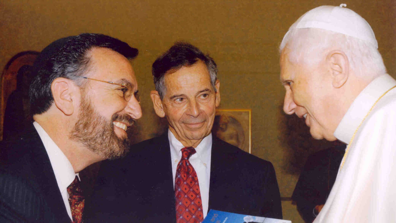 Rabbi David Rosen, left, meets with Pope Benedict XVI, right, during the American Jewish Committee’s leadership audience with the pope at the Vatican, March 2006. At center is E. Robert Goodkind, AJC president at the time. (American Jewish Committee)