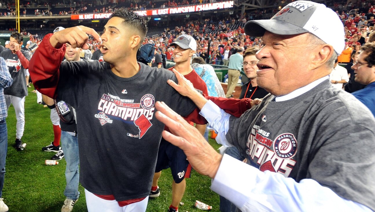 Gio Gonzalez #47 of the Washington Nationals celebrates with owner Ted Lerner after winning the National League East Division Championship after the game against the Philadelphia Phillies at Nationals Park, Oct. 1, 2012 (G Fiume/Getty Images)