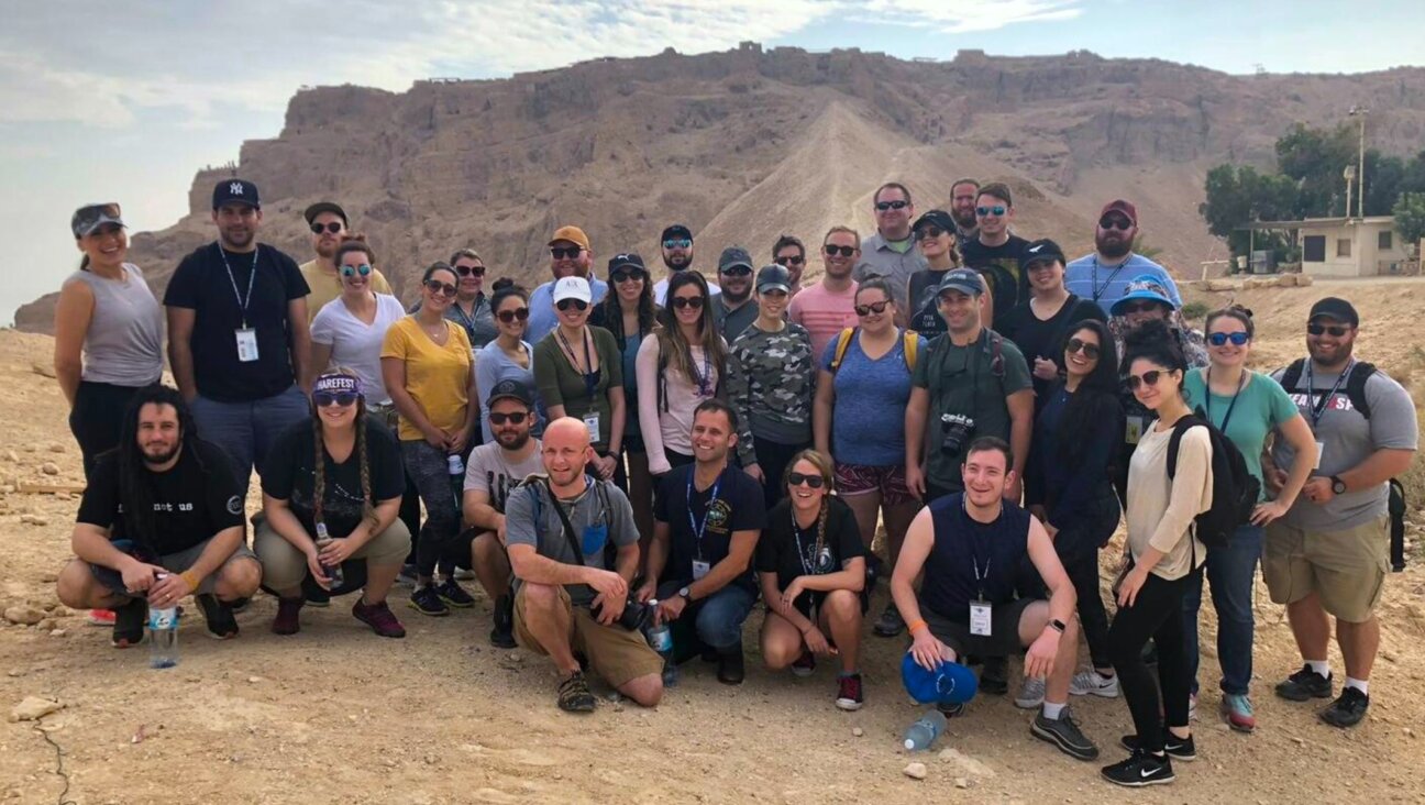 Participants of a 2018 Birthright trip for adults ages 27-32 visit the Masada fortress in Israel. (Courtesy of Ashley Inbar)
