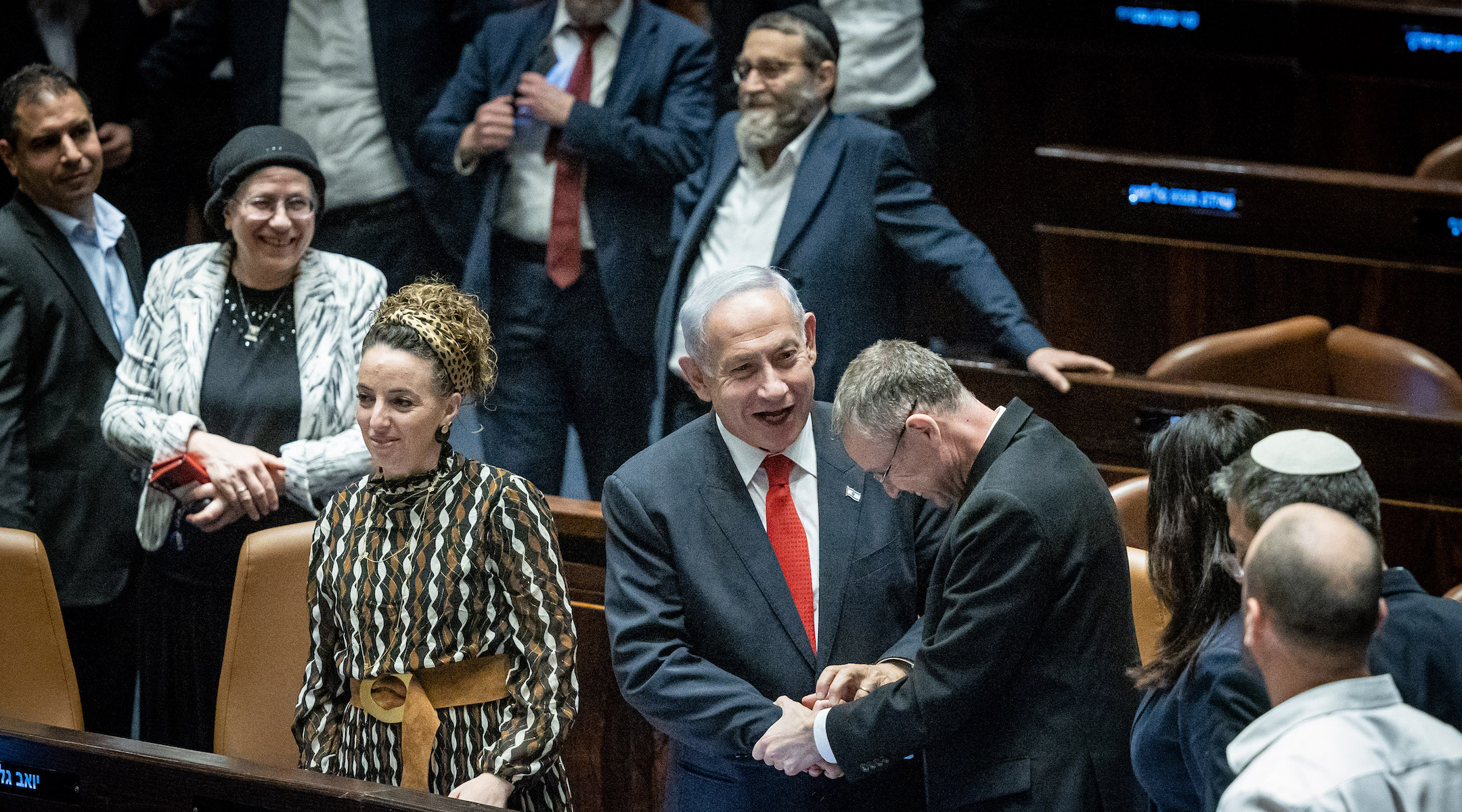 Israeli Prime Minister Benjamin Netanyahu and his allies celebrate a vote advancing key pieces of his coalition’s judicial reform. (Yonatan Sindel/Flash90)
