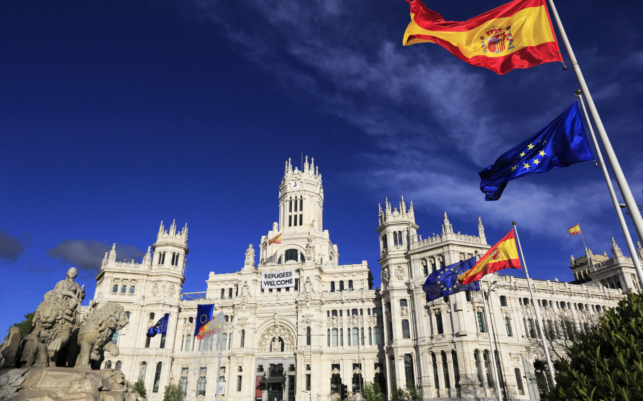 Cybele Palace, the Madrid City Hall, on Cibeles Square with the Cibeles Fountain,Spanish and EU flags in foreground. (Getty Images)