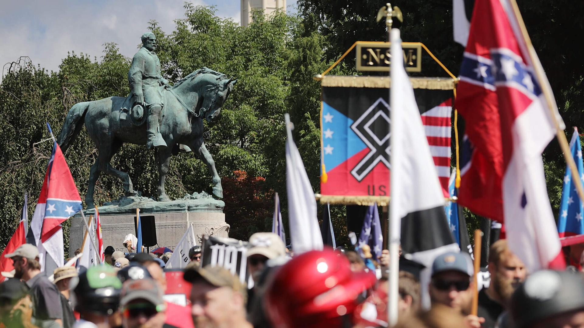 A Confederate statue stands behind a crowd of white nationalists and neo-Nazis during the 2017 “Unite the Right” rally in Charlottesville, Virginia. (Getty Images)