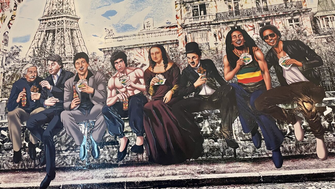 Lenny Kravitz, Bob Marley, Albert Einstein, Charlie Chaplin, and the Mona Lisa are among those enjoying falafel on the Rue des Rosiers.