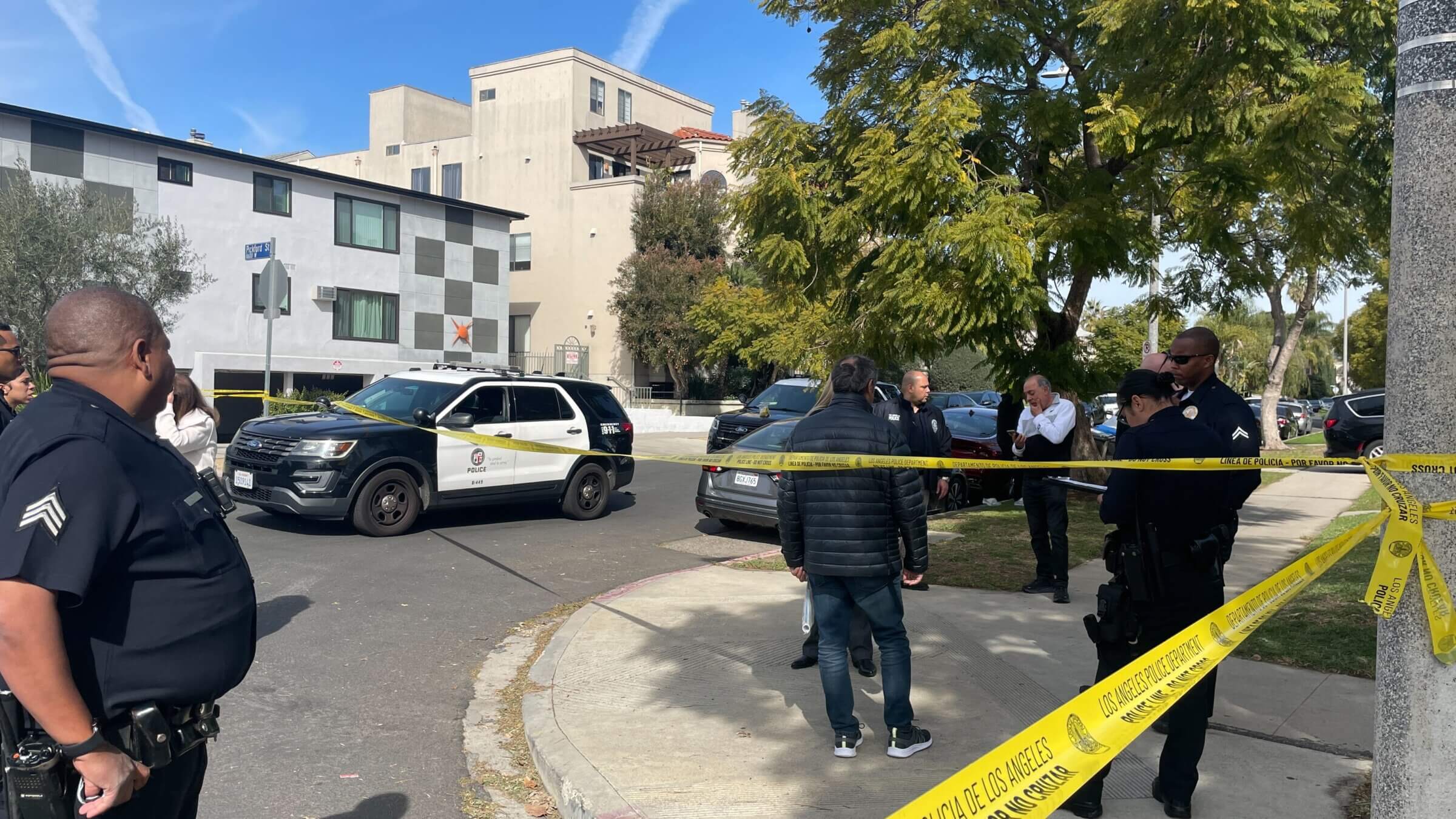 Police remain on the scene hours after  a Jewish man was shot on Feb. 16, 2023, after leaving morning services at the Pinto Synagogue in the Pico-Robertson neighborhood of Los Angeles.