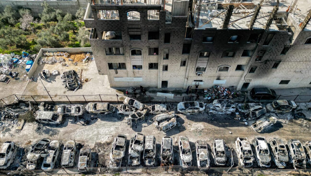 This picture taken on February 27, 2023 shows an aerial view of a scrapyard where cars were torched overnight, in the Palestinian town of Huwara near Nablus in the occupied West Bank. - Two Israelis living in the Har Bracha settlement near Nablus were killed on February 26 in a "Palestinian terror attack", officials said, sparking violence in which a Palestinian man was killed, while settlers torched homes in revenge. 