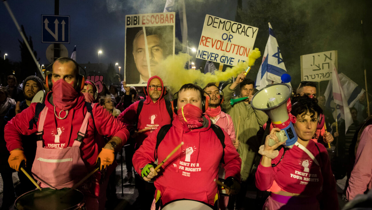 Protesters march as tens of thousands of Israelis attend a demonstration against the government's judicial plans on February 20, 2023 in Jerusalem, Israel. 