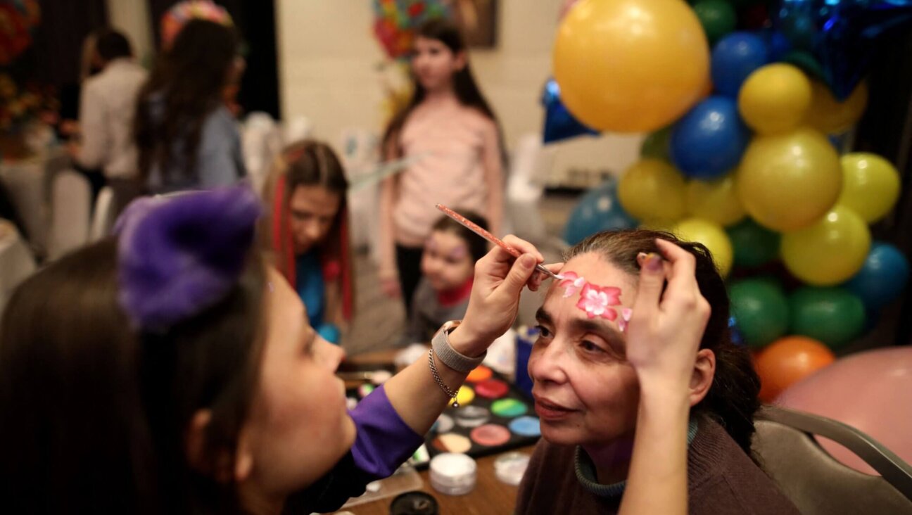 Ukrainian Jewish refugees who fled the war celebrate the Jewish holiday of Purim at Chabad-Lubavitch synagogue in Chisinau on March 16, 2022. 