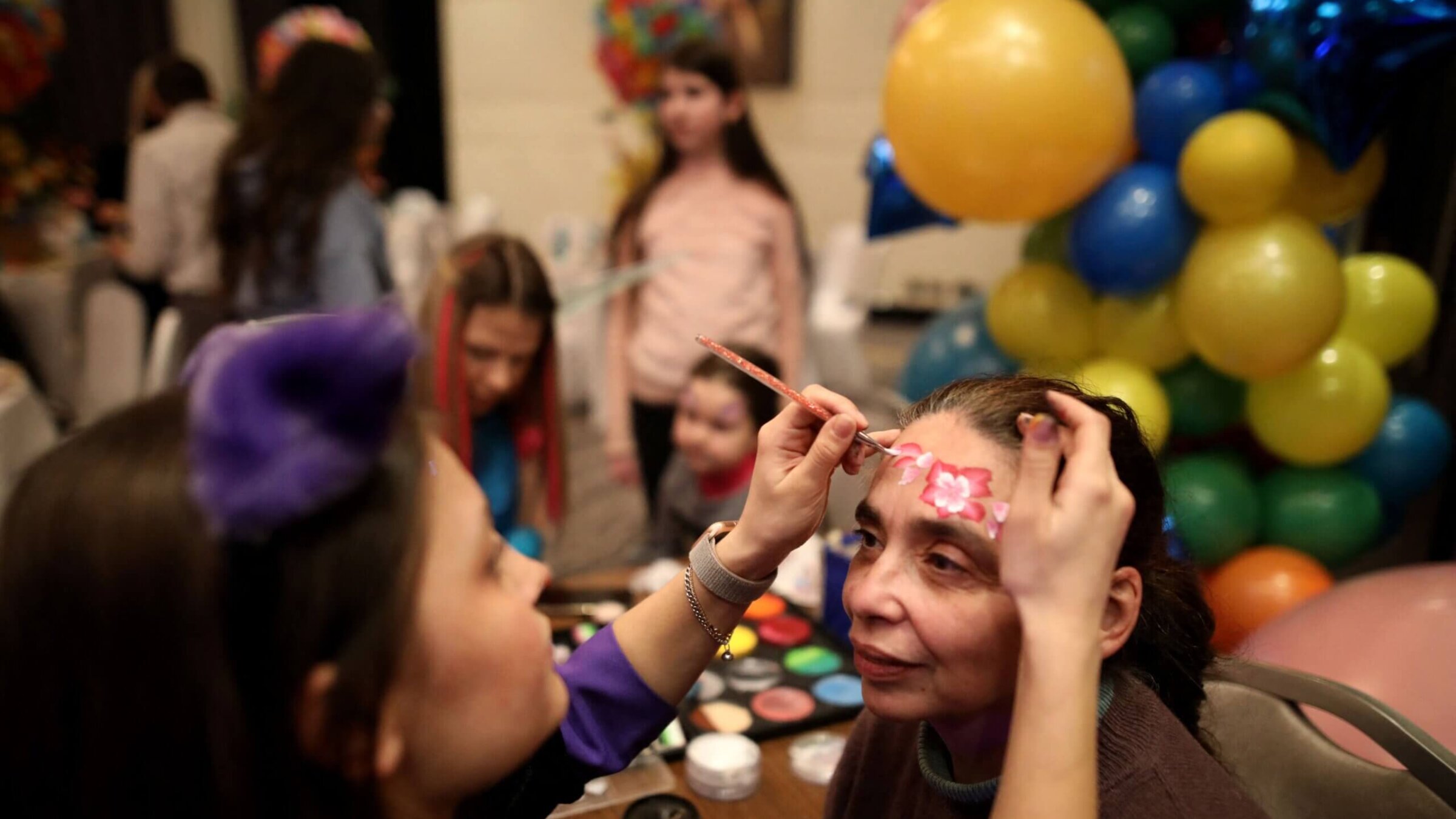 Ukrainian Jewish refugees who fled the war celebrate the Jewish holiday of Purim at Chabad-Lubavitch synagogue in Chisinau on March 16, 2022. 