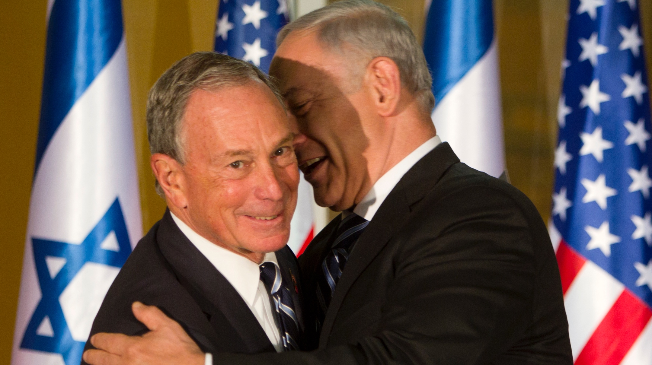 New York City Mayor Michael Bloomberg and Israeli Prime Minister Benjamin Netanyahu embrace after they both made short statements at the prime minister’s residence in Jerusalem, Oct 23, 2011. (Jim Hollander-Pool/Getty Images)