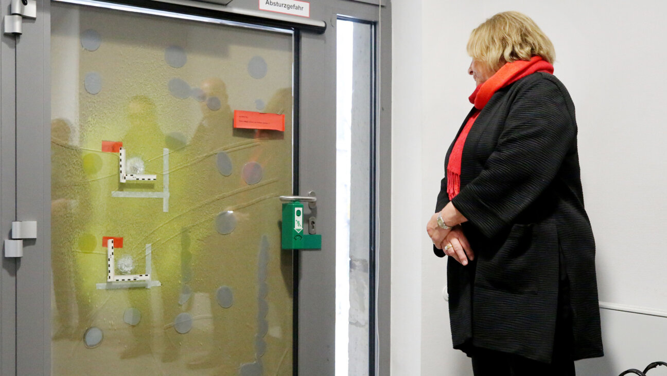 Sabine Leutheusser-Schnarrenberger, the anti-Semitism commissioner of North Rhine-Westphalia, Surveys the Bullet holes on the door of Essen’s Old Synagogue. (Photo by Roland Weihrauch/picture alliance via Getty Images)