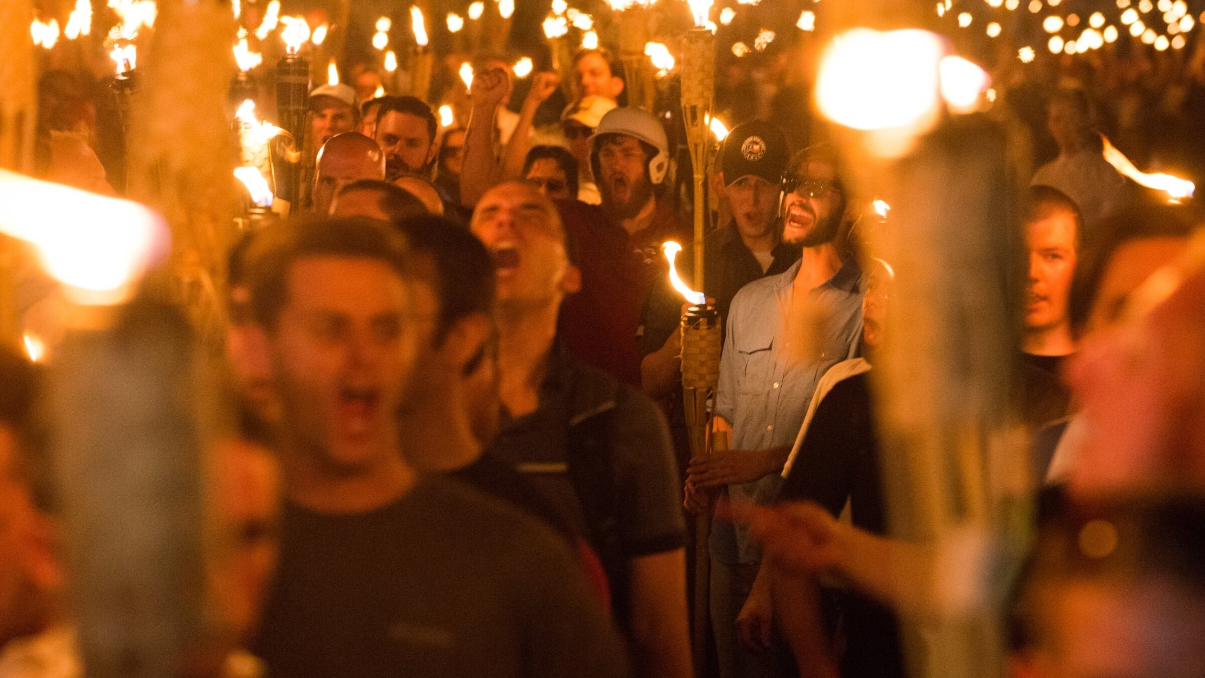 Neo-Nazis and white Supremacists take part in a march the night before the Unite the Right rally in Charlottesville, Va., Aug. 11, 2017.