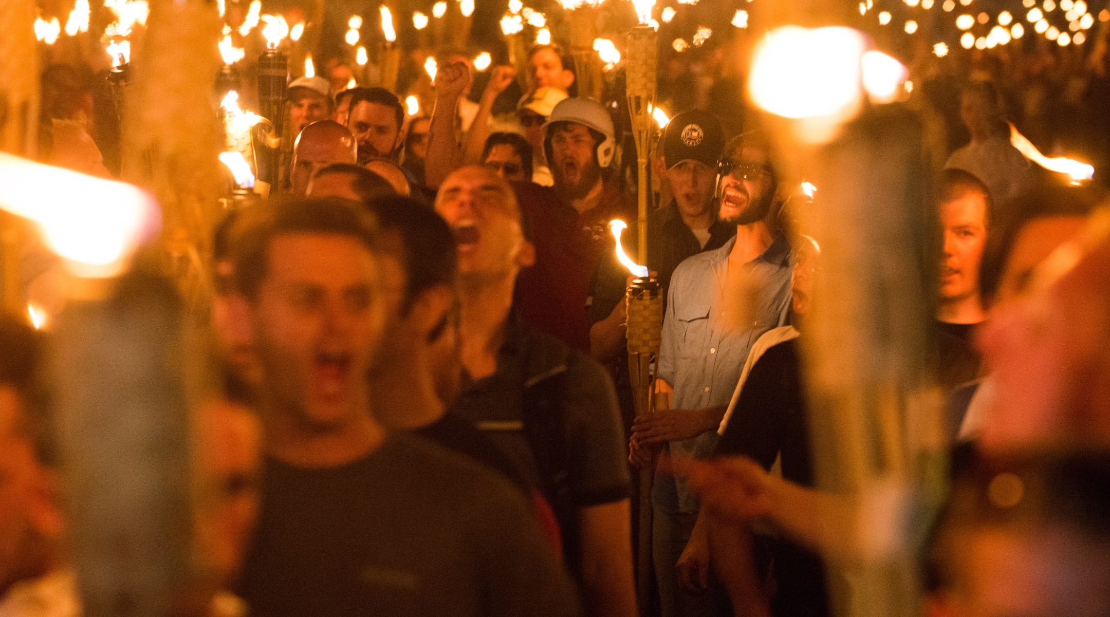 Neo-Nazis and white Supremacists take part in a march the night before the Unite the Right rally in Charlottesville, Va., Aug. 11, 2017. (Zach D Roberts/NurPhoto via Getty Images)