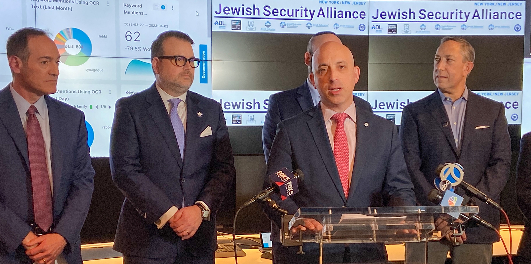 Anti Defamation League CEO Jonathan Greenblatt speaks at a press conference announcing the Jewish Security Alliance at the ADL’s investigative research lab. Behind him is Scott Richman, the regional director of ADL’s New York-New Jersey Office, CSS CEO Evan Bernstein and CSI Executive Director Mitch Silber. (Photo Credit: Jacob Henry)