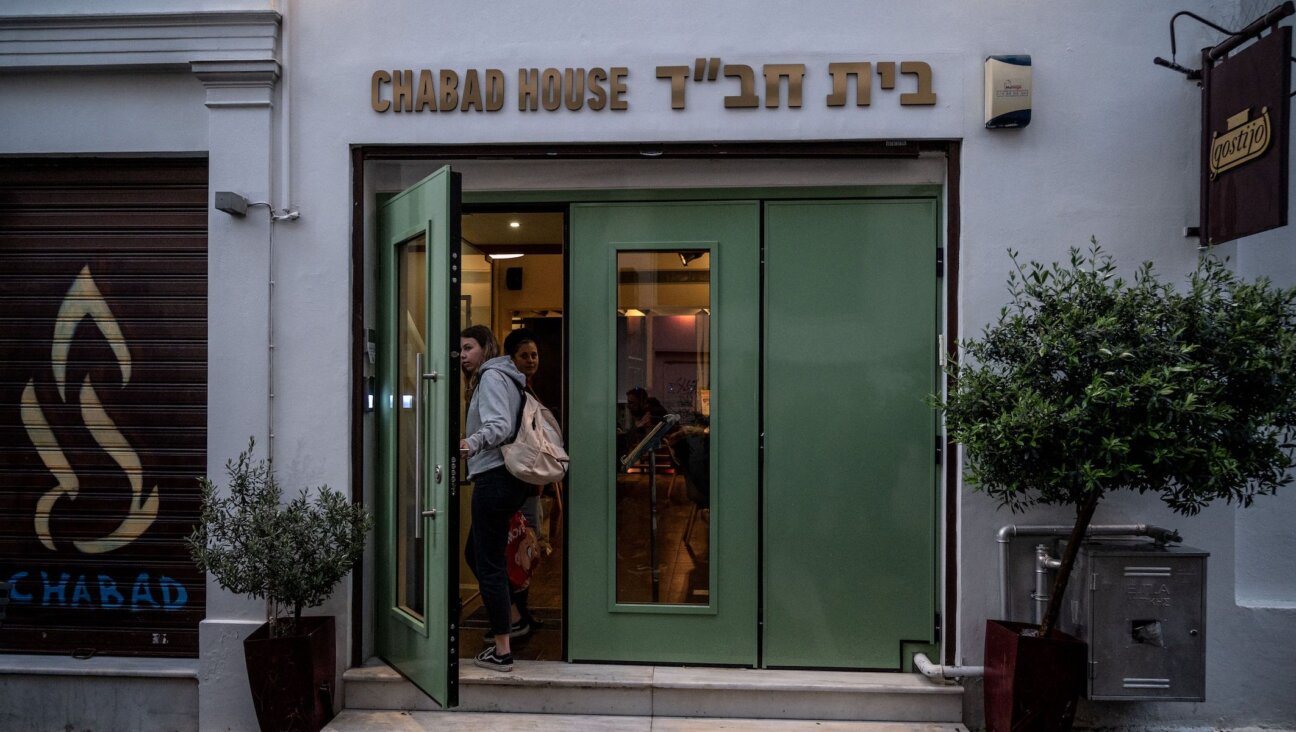 Women enter a Jewish restaurant in central Athens, March 28, 2023. Greek police sources said they arrested two men who targeted the building. (Angelos Tzortzinis/AFP via Getty Images)