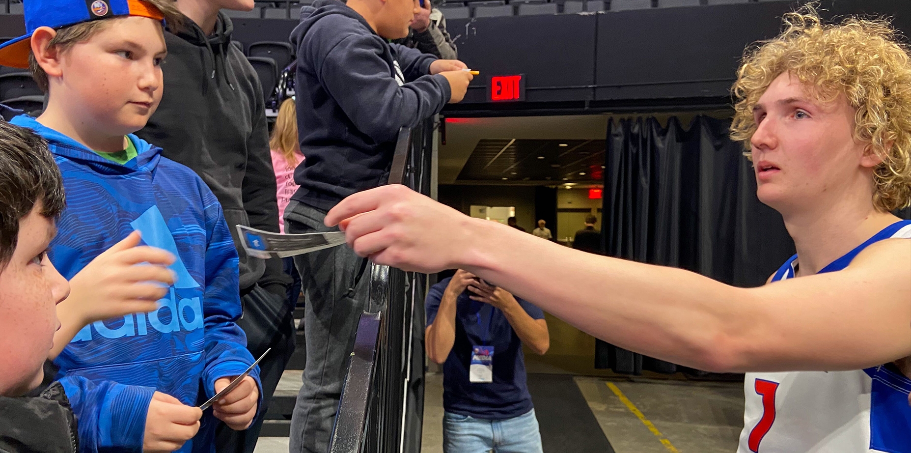Orthodox NBA G League player Ryan Turell signs autographs for Jewish fans after the at the Nassau Coliseum in Uniondale, New York on Tuesday, March 8, 2023. (Jacob Henry)