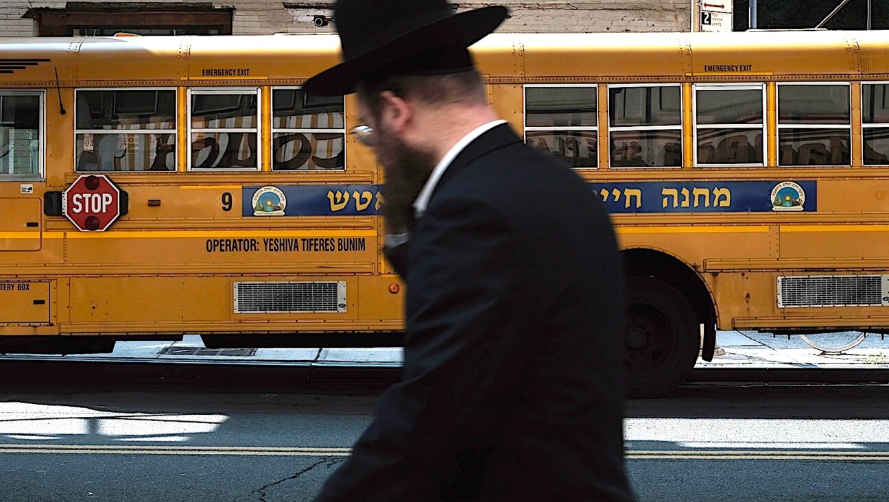 A yeshiva school bus drives through Brooklyn’s Borough Park on Sept. 12, 2022.(Spencer Platt/Getty Images)