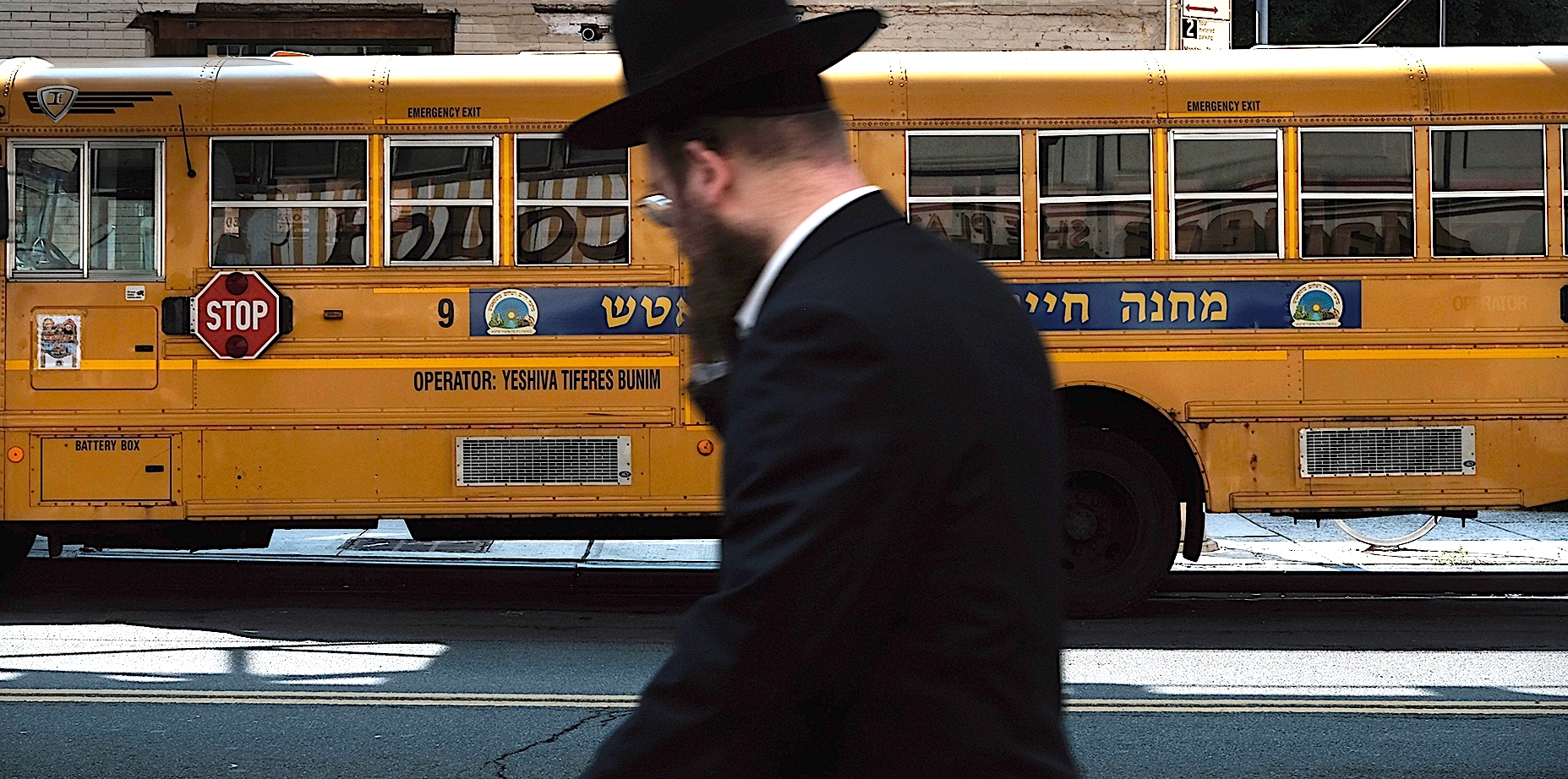A yeshiva school bus drives through Brooklyn’s Borough Park on Sept. 12, 2022.(Spencer Platt/Getty Images)