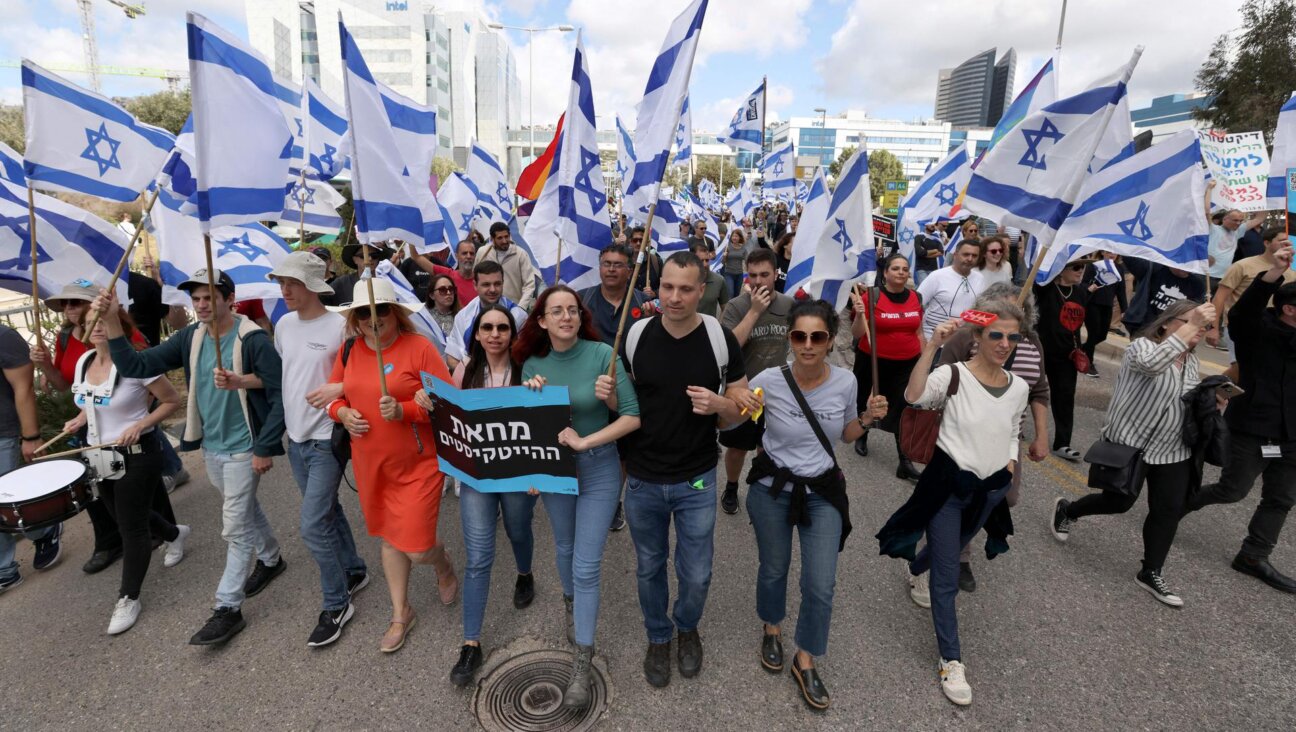 Israelis protest against their government's controversial judicial reform bill, in Haifa on March 9, 2023.
