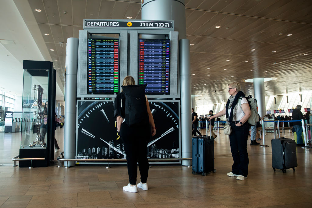 A departure board at Ben Gurion Airport shows all flights canceled until further notice. (Getty)