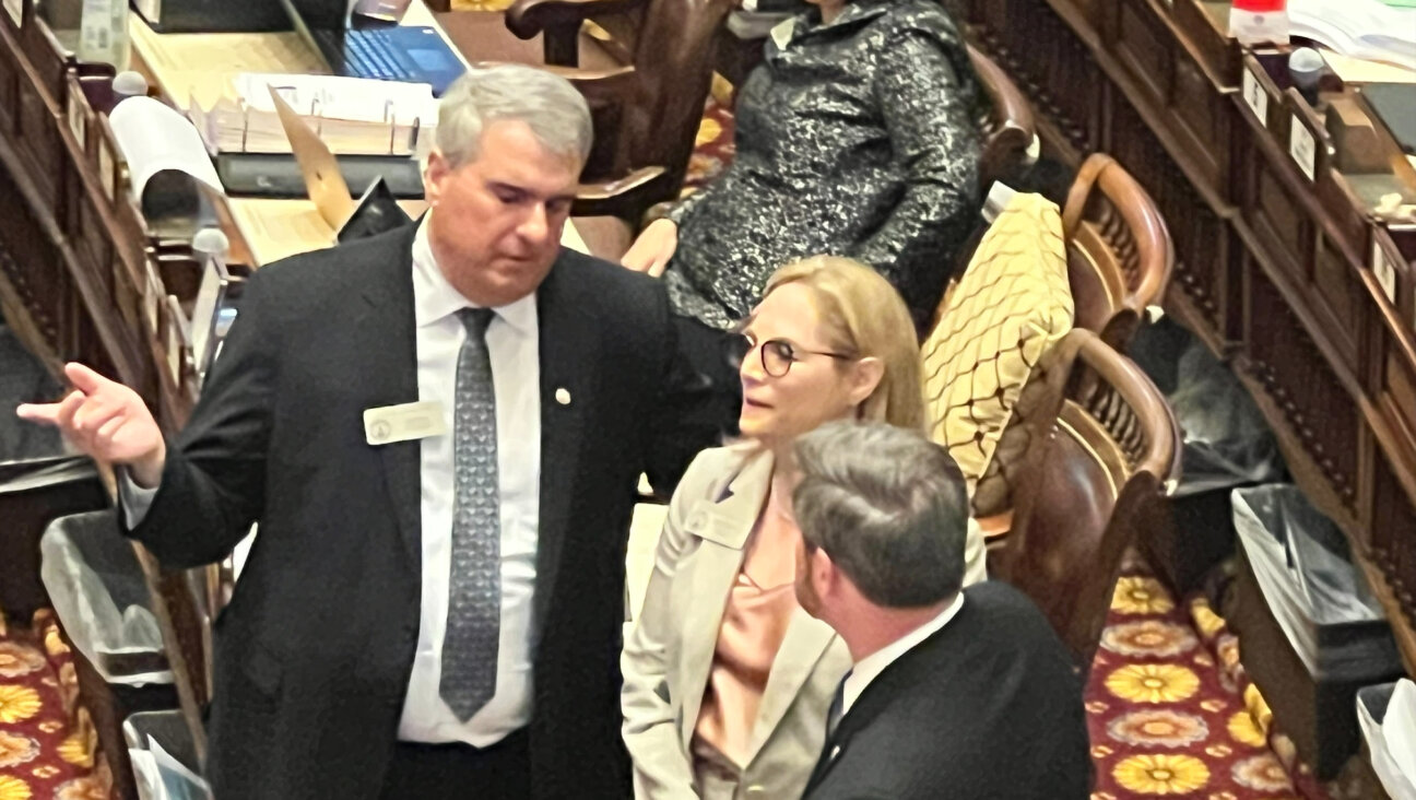 Democrat Esther Panitch (center), Georgia's only Jewish legislator, stands with Republican John Carson (left). The two co-sponsored a bill defining antisemitism that recently was approved by the state House of Representatives. The state Senate did not vote on the bill before the legislative session ended. 